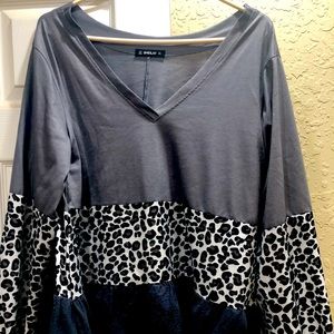 Leopard print and gray top. Size shows large but it fits like and X-Large.